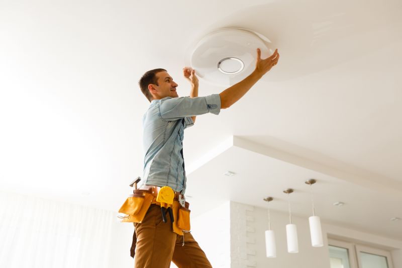 Handyman Fixing Light Fixture